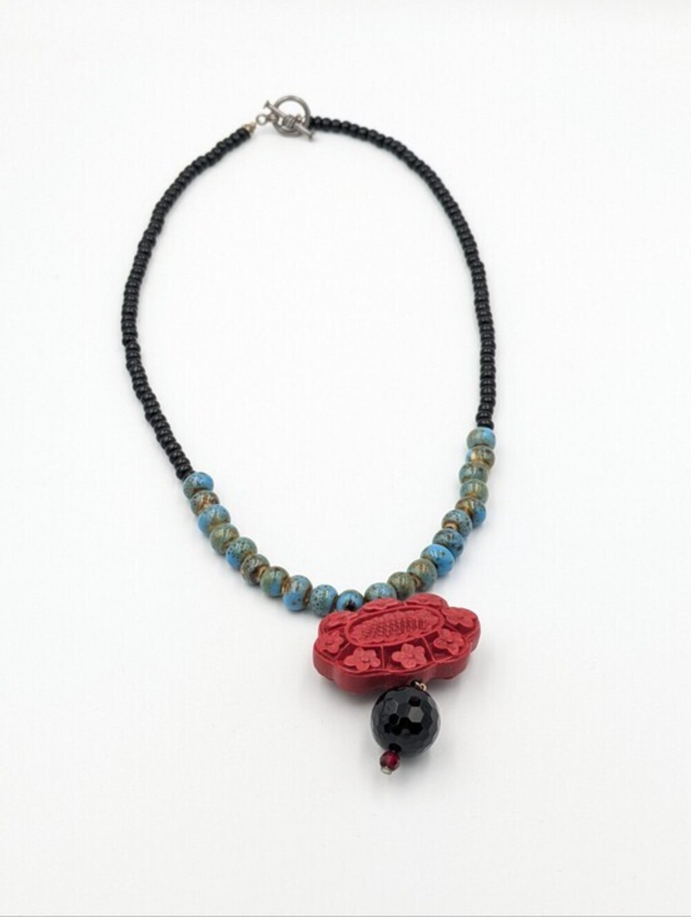 Carved cinnabar beaded necklace